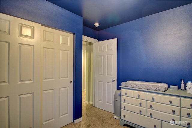 carpeted bedroom with a closet