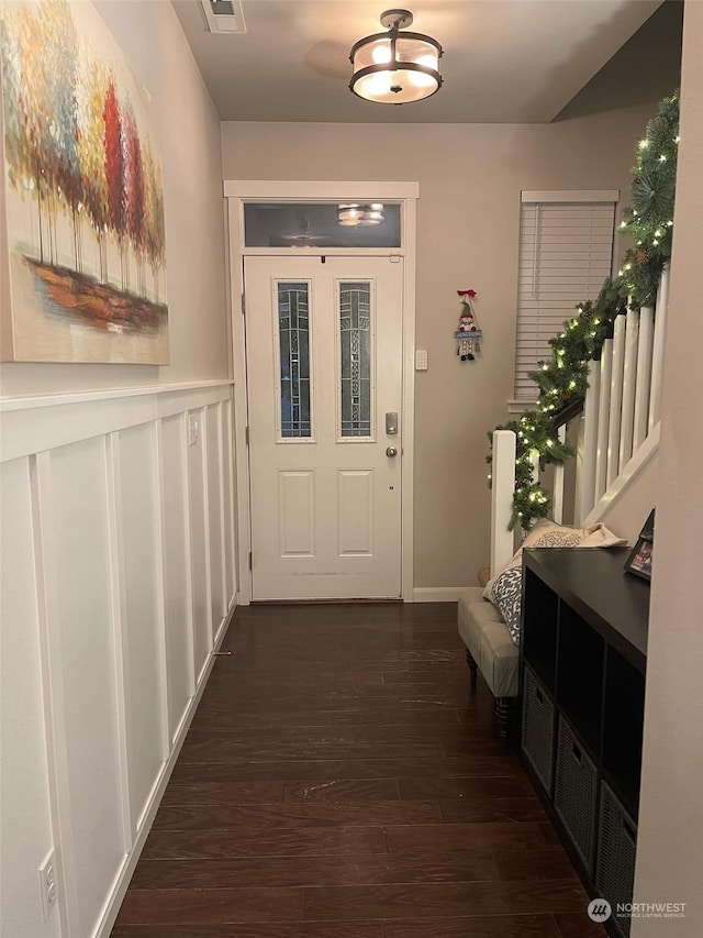 hallway with dark hardwood / wood-style floors