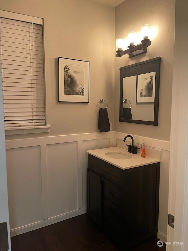 bathroom featuring vanity and hardwood / wood-style flooring