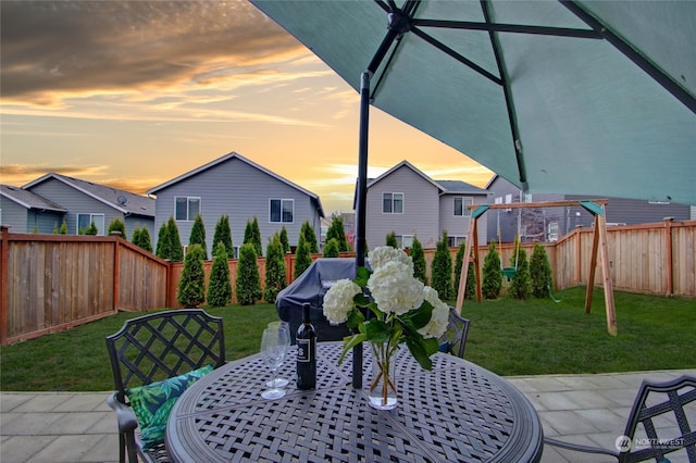 exterior space featuring a lawn and grilling area