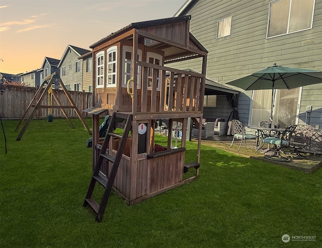 playground at dusk with a lawn