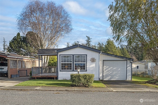 ranch-style home featuring a garage