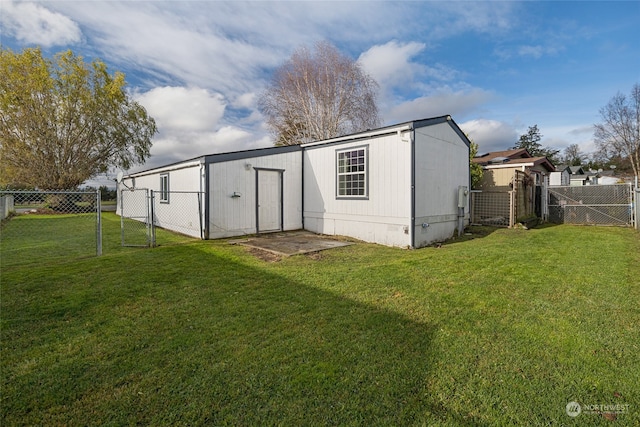 view of outbuilding with a lawn