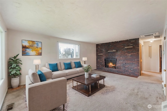 carpeted living room with a fireplace