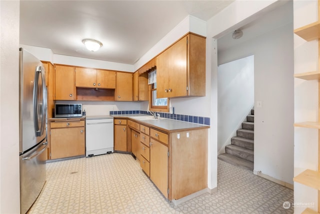 kitchen featuring stainless steel appliances and sink