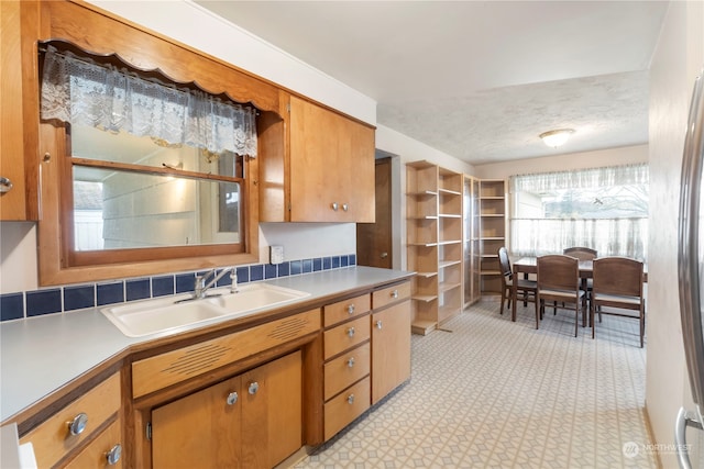 kitchen with sink and a textured ceiling