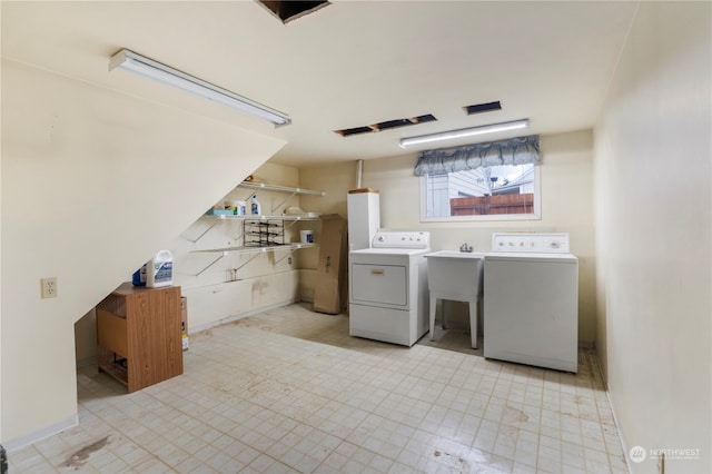 clothes washing area featuring washer and clothes dryer