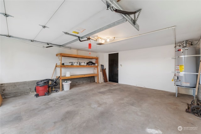 garage with a garage door opener and water heater