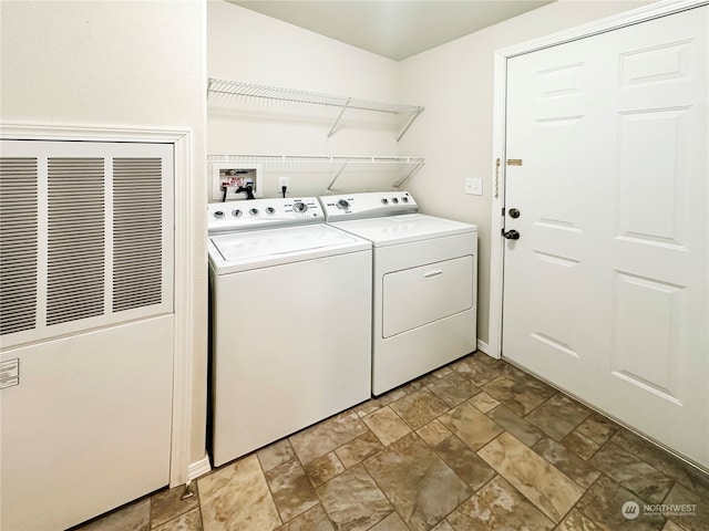 laundry room with washing machine and clothes dryer