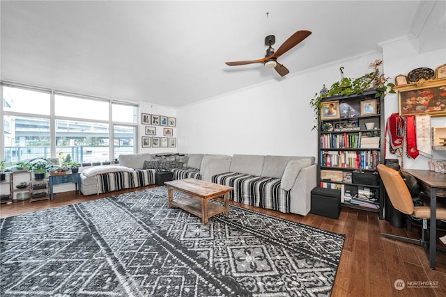 living room featuring ceiling fan, dark hardwood / wood-style flooring, and ornamental molding