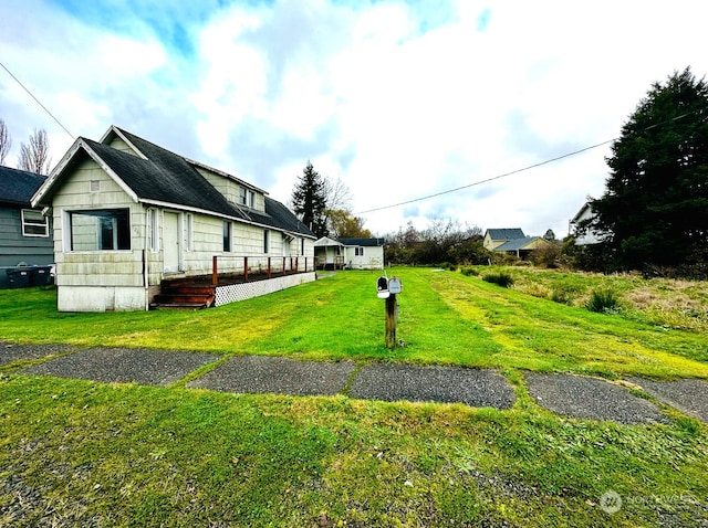 view of property exterior with a lawn