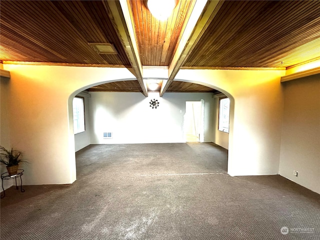 interior space with beam ceiling and wood ceiling