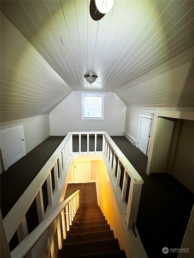 bonus room featuring hardwood / wood-style flooring, lofted ceiling, and a baseboard radiator