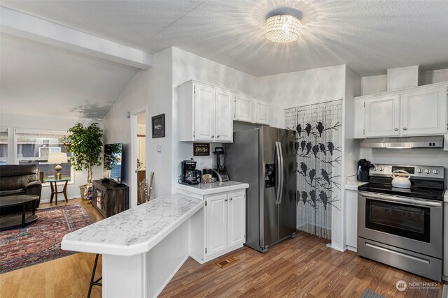 6205 NE Central Valley Rd NE, Bremerton, WA 98311 - kitchen featuring appliances with stainless steel finishes, under cabinet range hood, light countertops, a peninsula, and white cabinets