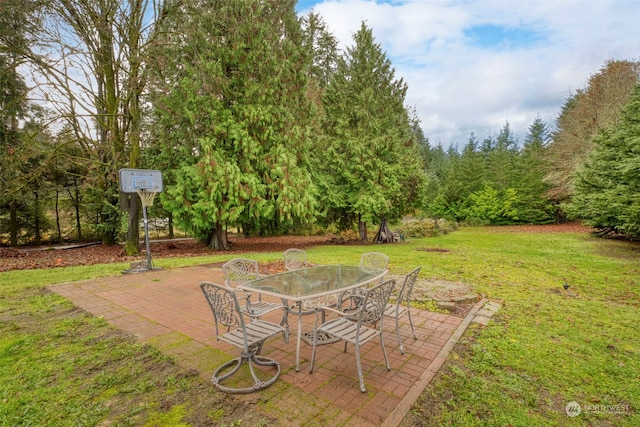 6205 NE Central Valley Rd NE, Bremerton, WA 98311 - view of grassy yard with a patio and outdoor dining area