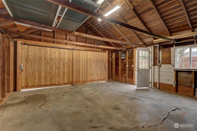 garage featuring wooden walls