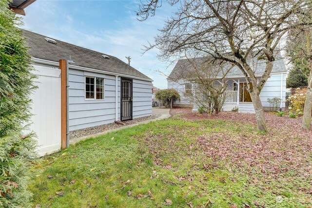 view of yard featuring covered porch