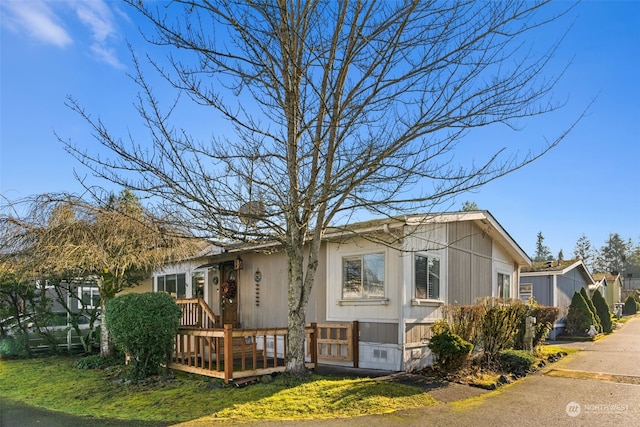 15410 SE 272nd St Unit 16, Kent, WA 98042 - view of home's exterior featuring a yard and a wooden deck