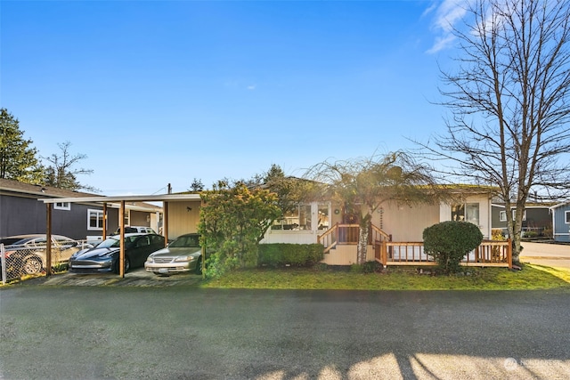 view of front facade featuring a carport