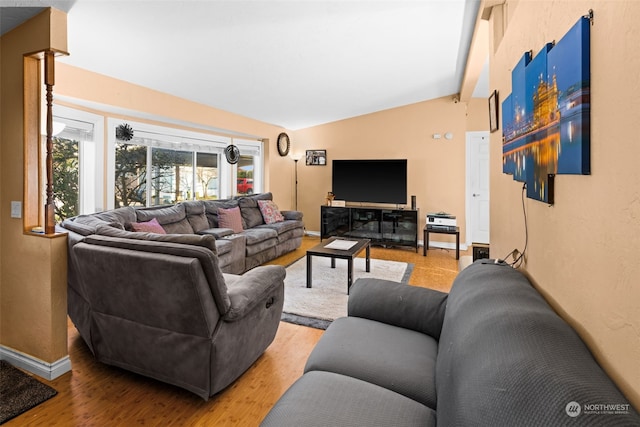 15410 SE 272nd St Unit 16, Kent, WA 98042 - living room featuring lofted ceiling, light wood-style floors, and baseboards