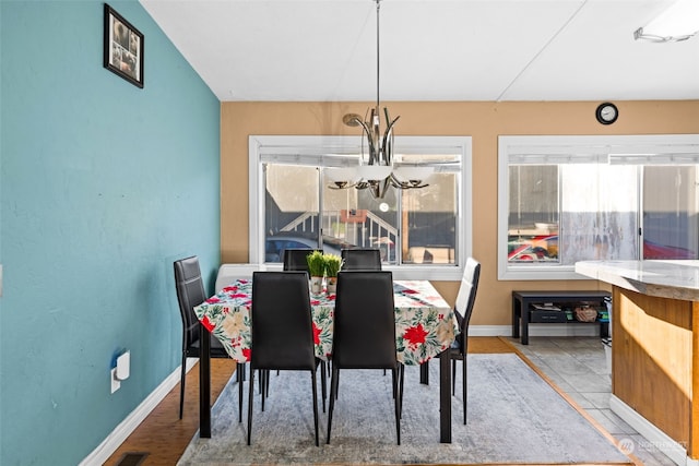 dining room featuring a chandelier and hardwood / wood-style floors