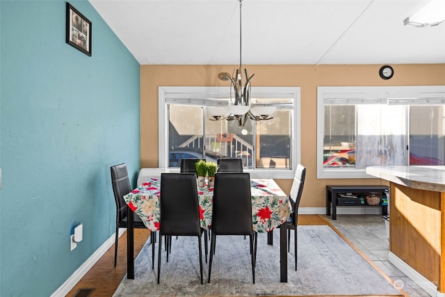 15410 SE 272nd St Unit 16, Kent, WA 98042 - dining area with a chandelier, healthy amount of natural light, and baseboards