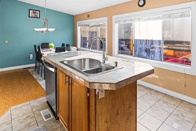 15410 SE 272nd St Unit 16, Kent, WA 98042 - kitchen featuring a sink, brown cabinetry, dishwasher, baseboards, and light tile patterned floors