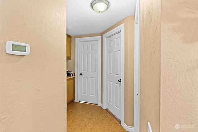 corridor featuring light wood-type flooring