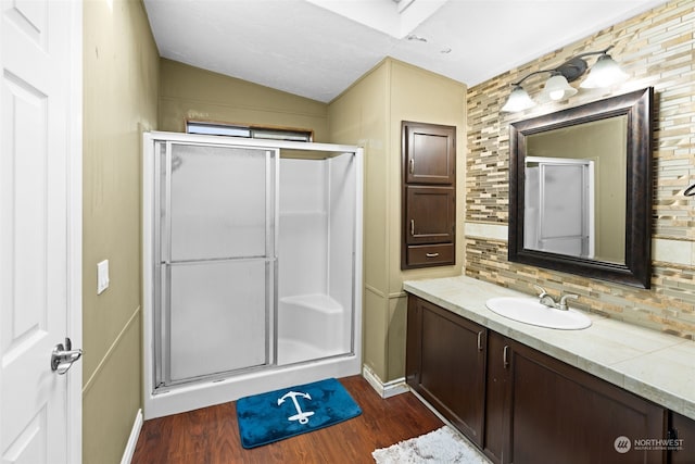 15410 SE 272nd St Unit 16, Kent, WA 98042 - full bath with decorative backsplash, vaulted ceiling, a shower stall, wood finished floors, and vanity