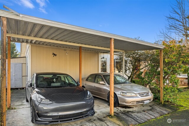 15410 SE 272nd St Unit 16, Kent, WA 98042 - view of vehicle parking with a carport