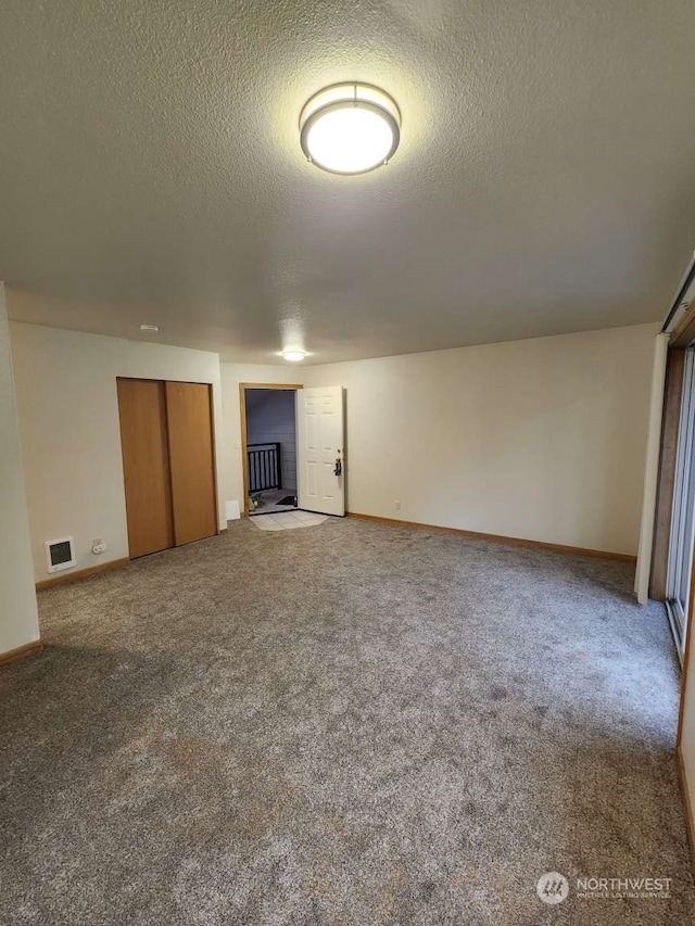 interior space with a textured ceiling