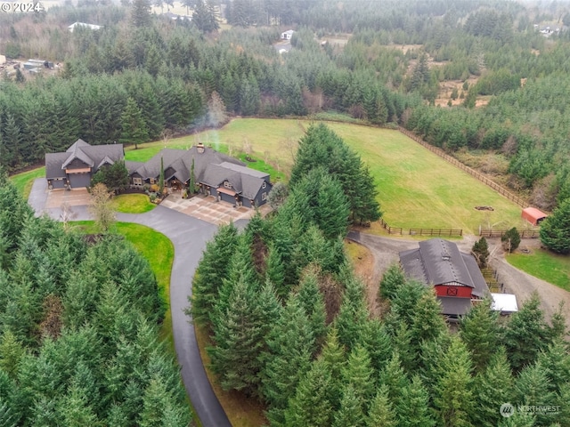 birds eye view of property featuring a rural view