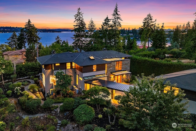 view of front of home with a water view