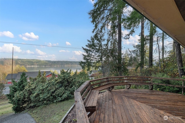 wooden deck featuring a water view