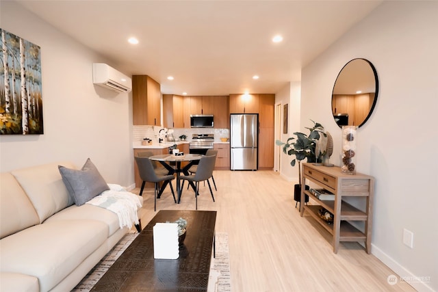 living room featuring light hardwood / wood-style floors, sink, and a wall mounted AC