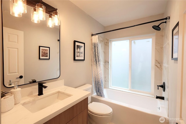 bathroom with toilet, shower / tub combo, and vanity