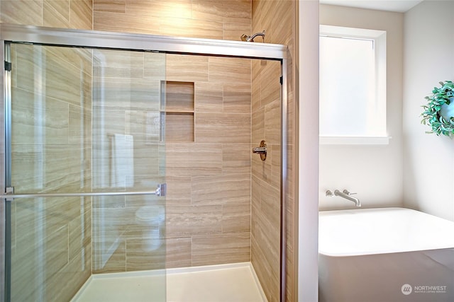 bathroom featuring an enclosed shower