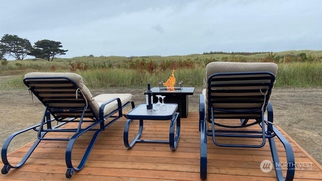304 14th St NW Unit 209, Long Beach, WA 98631 - wooden terrace with a fire pit
