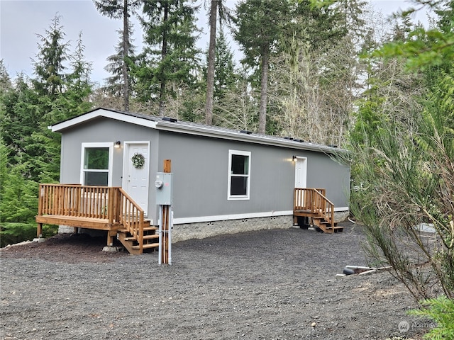 manufactured / mobile home with a wooden deck