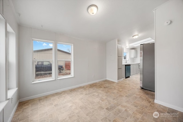 unfurnished room featuring sink