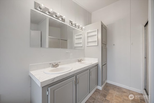 bathroom featuring vanity and crown molding