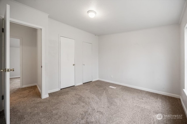 unfurnished bedroom with carpet flooring