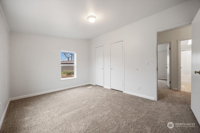 unfurnished bedroom with carpet floors