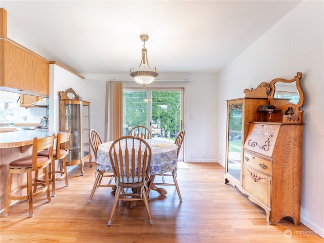 dining area featuring light wood-type flooring