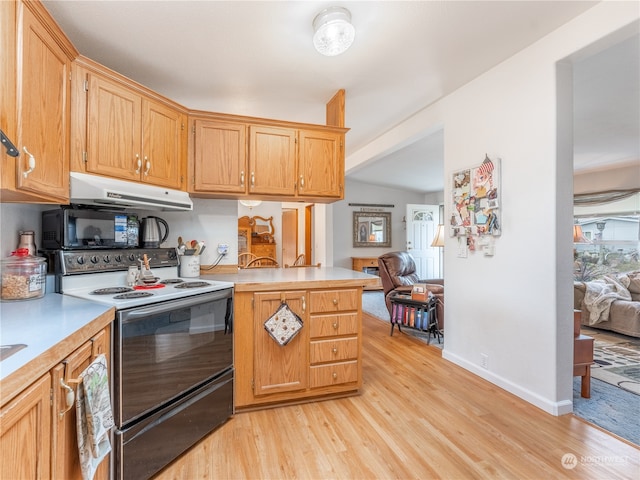 kitchen with electric range, lofted ceiling, kitchen peninsula, and light wood-type flooring