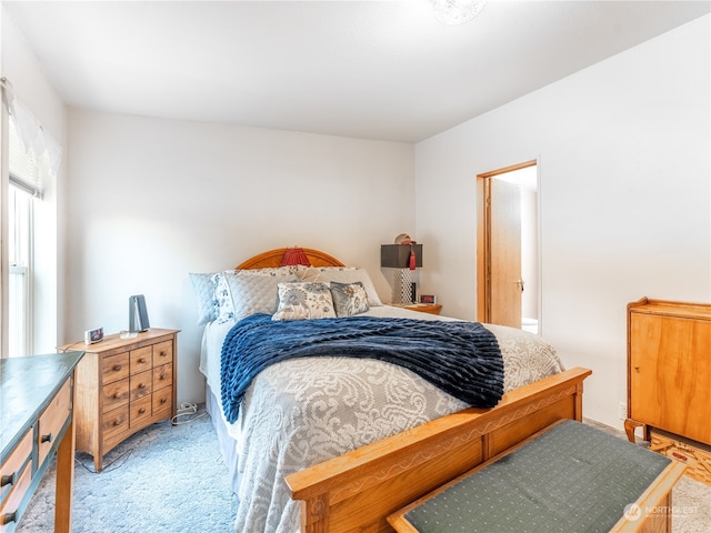 bedroom featuring light carpet