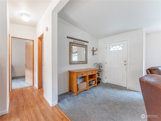 view of carpeted entrance foyer