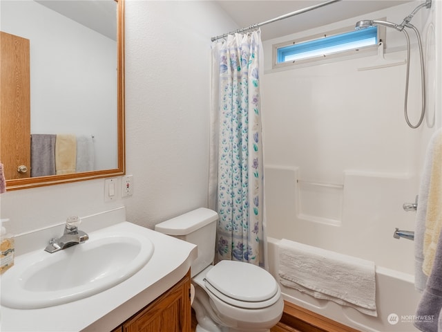 full bathroom with toilet, shower / tub combo, and vanity