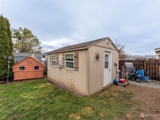 view of outbuilding with a yard