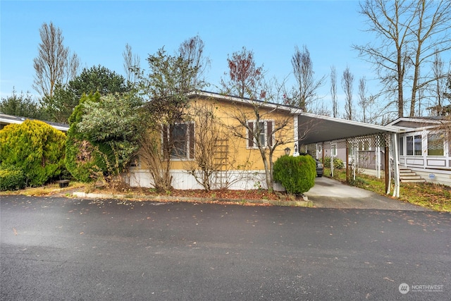 view of home's exterior featuring a carport